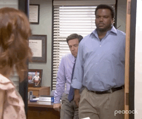 'The Office' gif. Man closes door on smiling woman.