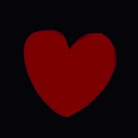 9 puzzles pieces come together to create a heart.