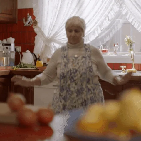 Women dancing in kitchen