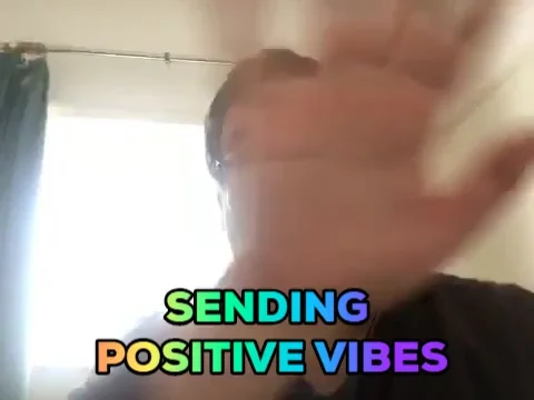 A man waving his hand. The text reads: 