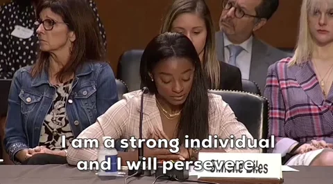 A woman at a congressional hearing says, 