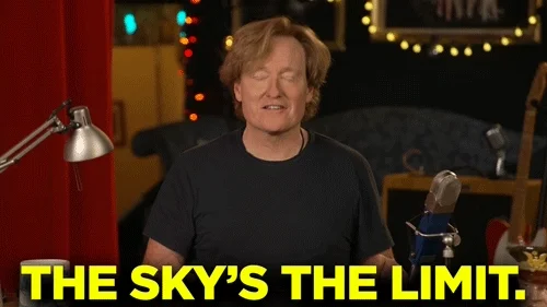 Conan O'Brien smiles and says, 
