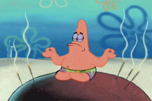 Patrick Starfish from Spongebob meditating on a rock under the sea. 