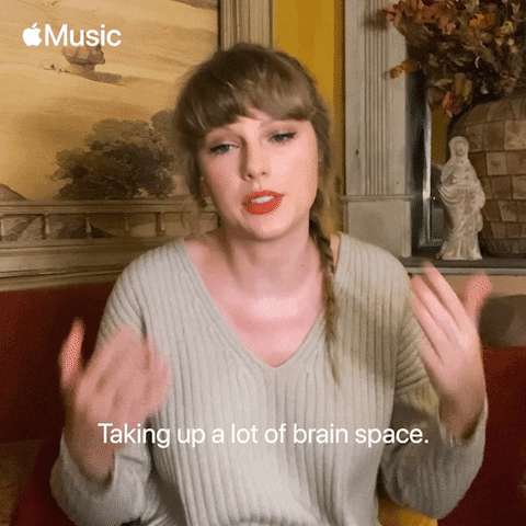 Taylor Swift in a cafe. She says, 'Taking up a lot of brain space.'