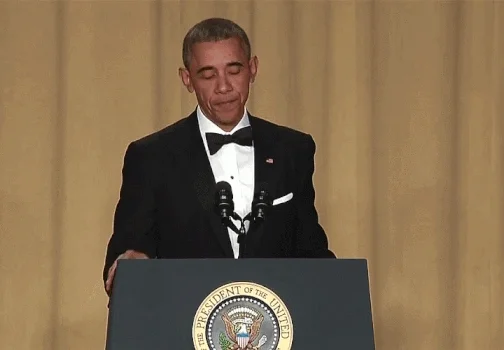 President Obama dropping a microphone during a speech.