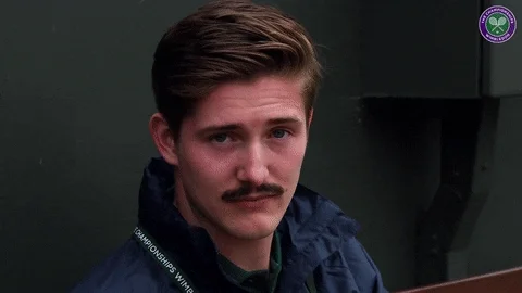GIF: Person with mustache raises their eyebrows in dynamic ways.