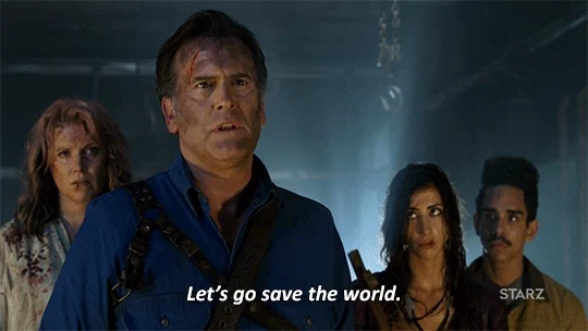 A man in a zombie movie says to a group, 'Let's go save the world.'