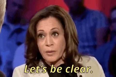 Kamala Harris speaking to a crowd. She says, "Let's be clear."