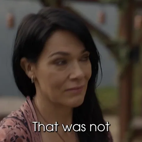 A woman is making a face and saying, 