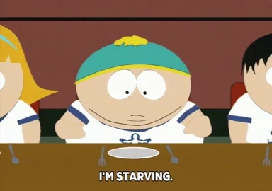 Meme of Cartman from South Park sitting at a table saying 'I'm starving, this is it. I'm going to die here.'