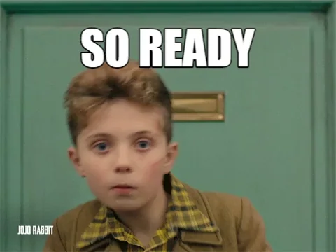 A boy dancing excitedly with the words 