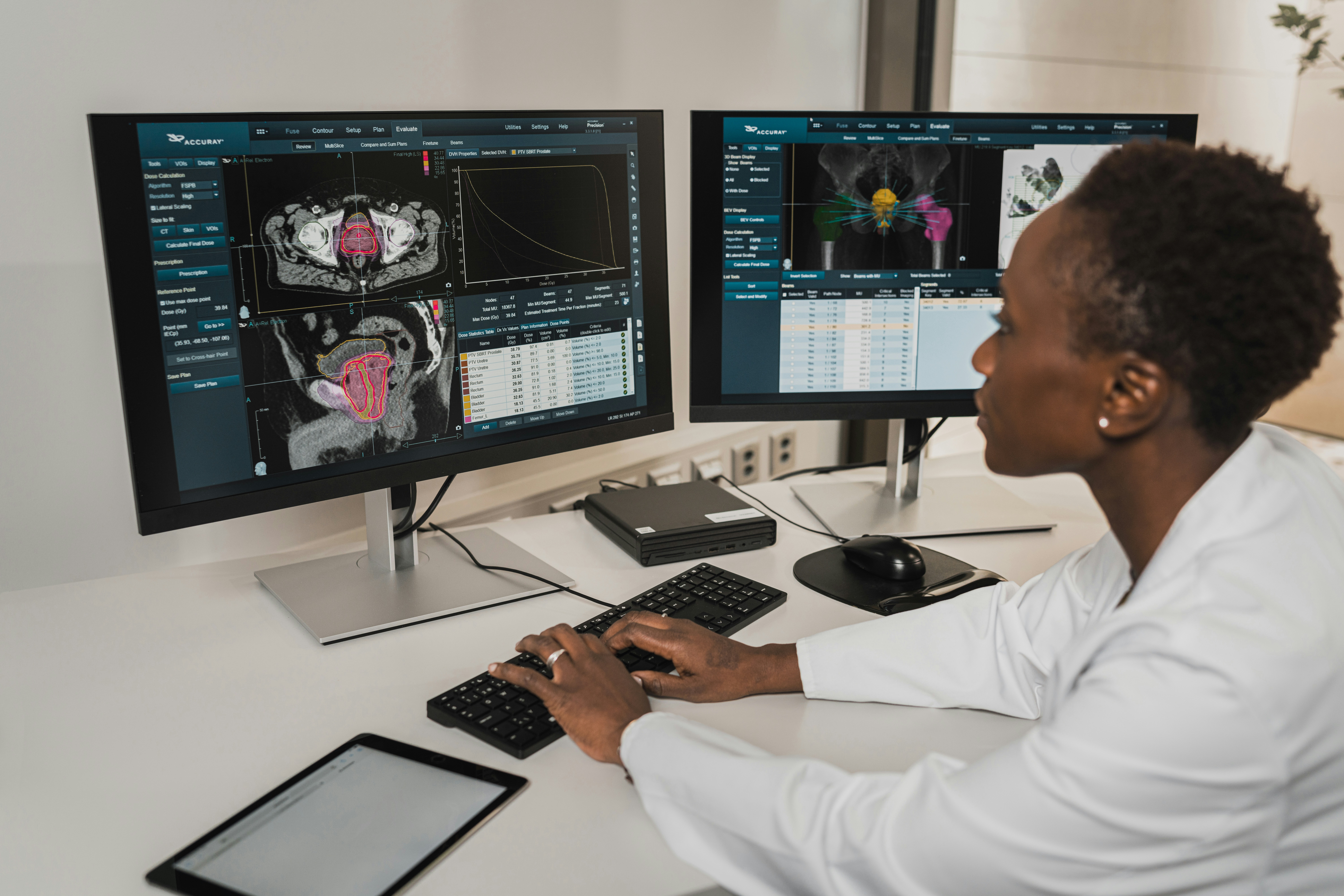 A woman in a white coat examining a medical scan.