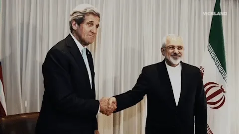 John Kerry, US Secretary of State, shaking hands with Mohammad Javad Zarif, Iranian Foreign Minister.