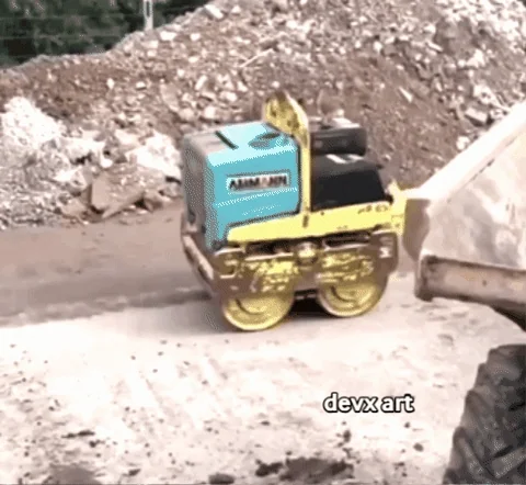 A worker on a construction site being dragged by a machine.