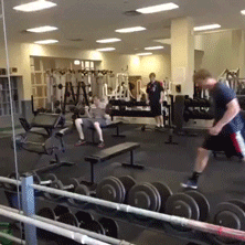 A person lifting weights at the gym. Later, they ride a treadmill in a funny way.