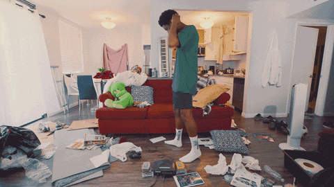 gif of someone trying to search a messy room