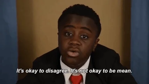 A kid saying, 'It's okay to disagree. It's not okay to be mean.'