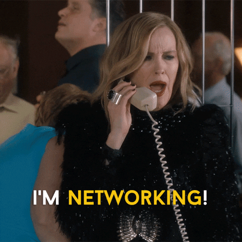 Moira from Schitt's Creek on the phone saying, 'I'm networking!'