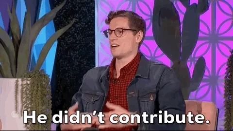 A man looking frustrated and putting his hands in front of himself, saying 