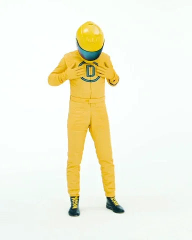 A person wearing a yellow jumpsuit, checking their pockets which are empty. The text says, 