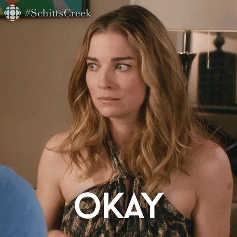 White woman brushing her hair to the side, with the caption: 