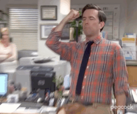 Andy from The Office motioning, 'My mind is blown,' with his hand