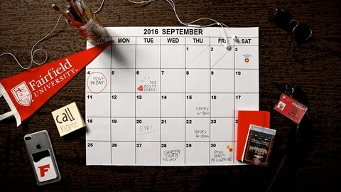 A university student planning out events on a calendar.