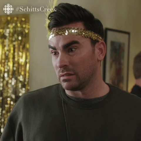 David Rose from Schitt's Creek shakes his head and says, 