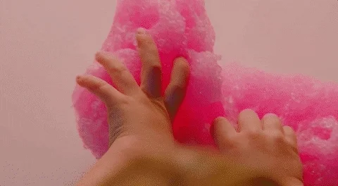 Hands squishing through homemade slime