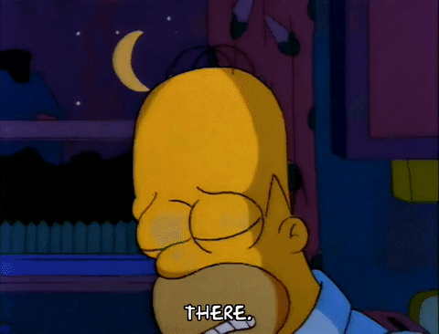 Homer Simpson has a connected set of puzzle pieces in his hand, saying 'there'