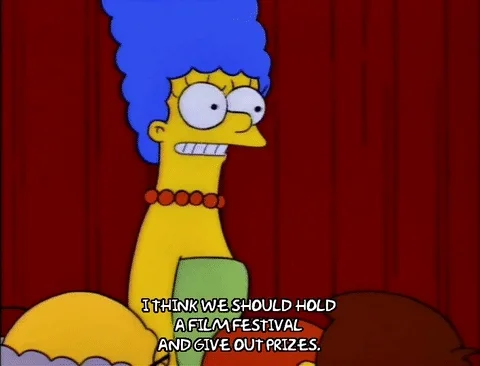 Marge Simpson saying, 'I think we should hold a film festival and give out prizes.'