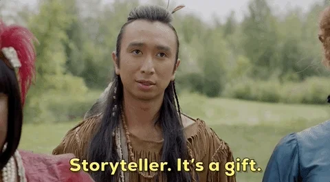 A young Indigenous American young male winking. Text Storyteller. It's a gift.