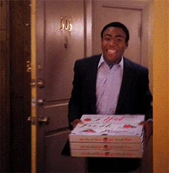 Donald Glover in Community walking into a room on fire.