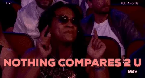 Woman grooving to music at concert. Text says, 'Nothing compares 2U.'