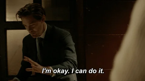 A man takes a deep breath and says, “It’s okay. I can do it,” with a look of determination on his face.