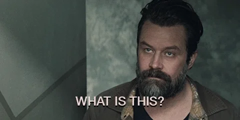 Two men are talking on a staircase. One asks, 