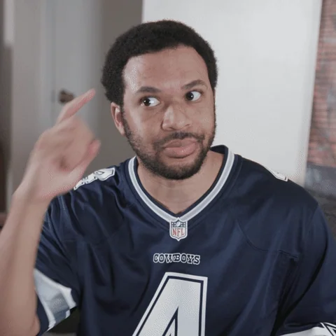 A man pointing to his head.