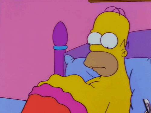 Homer Simpson looking at his rumbling belly
