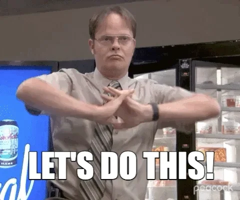Dwight Schrute from The Office, flexing his hands, saying, 'Let's do this!' The same words are on the screen. 