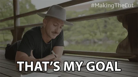 A man checking his notes and saying, "That's my goal."