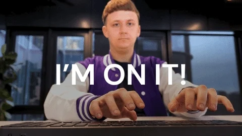 A person in purple jacket typing fast on the computer with the gif showing 'I'm on it!'