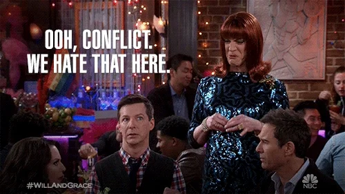 A person in a restaurant exclaiming 'Ooh, conflict. We hate that here.'