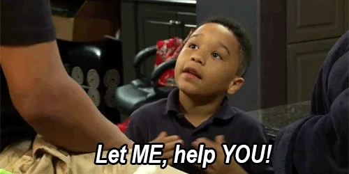 A young boy points at himself,  and then an adult. He says, 