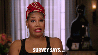 A woman saying, 'Survey says...'
