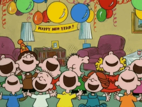Peanuts characters celebrating the new year with balloons falling down from the ceiling.