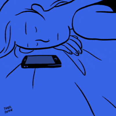 A person opening their eyes to an email notification on their phone. 