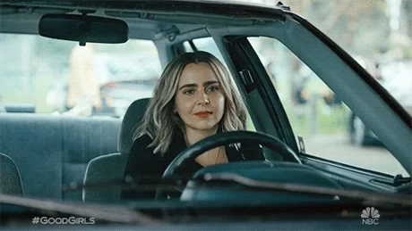Good Girls actress Mae Whitman sits in her car daydreaming. She imagines a butterfly flapping its wings.
