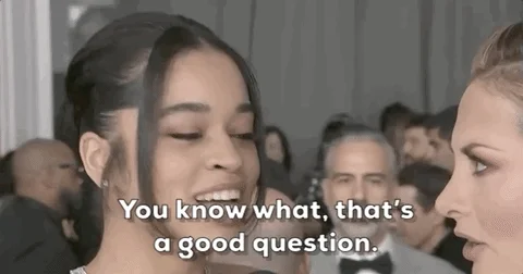 A young woman at awards show, saying to interviewer: 'You know, that's a good question.'