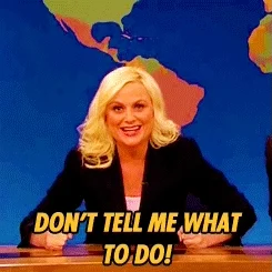 Amy Poehler in front of a blue map background, pointing. She says, 