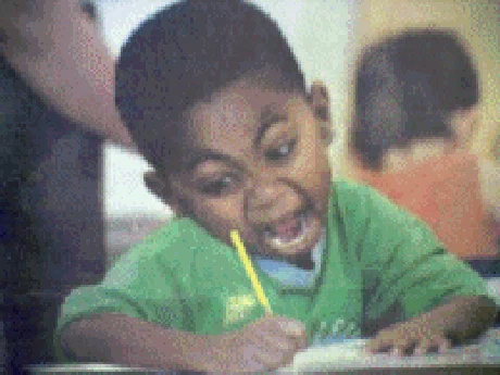 A kid frantically taking an exam.